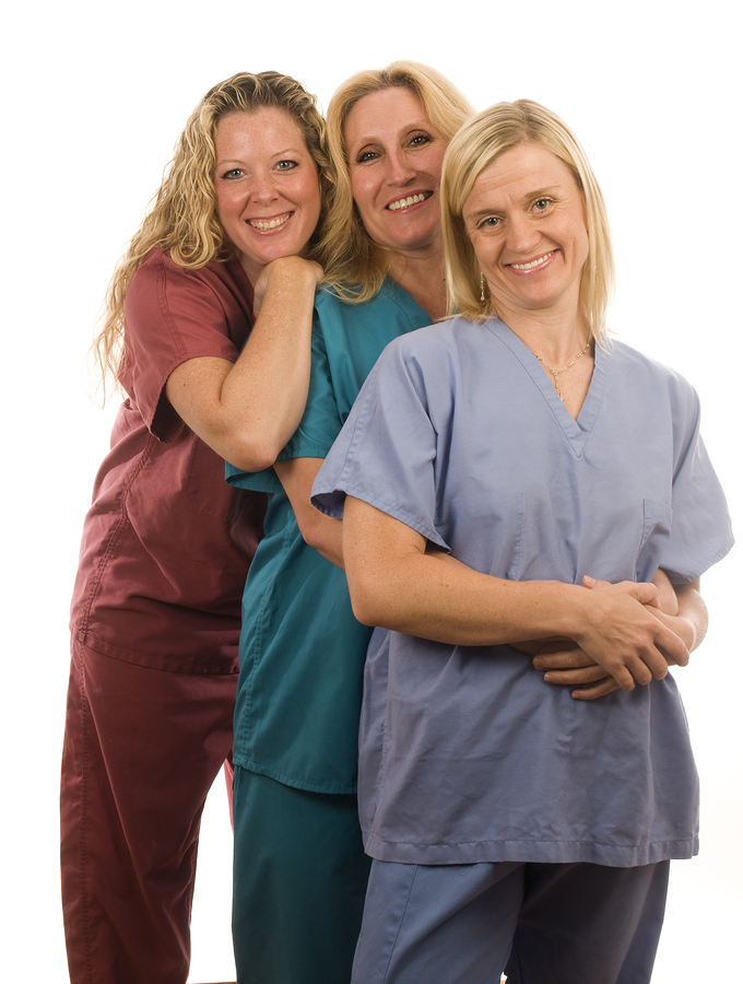 bigstockphoto_Three_Nurses_In_Medical_Scrubs_5668111